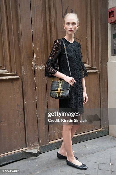 Model Yulia Lobova wears a Dolce and Gabbana dress, Celine bag and Chanel shoes on day 4 of Paris Collections: Womens Haute Couture on July 04, 2013...