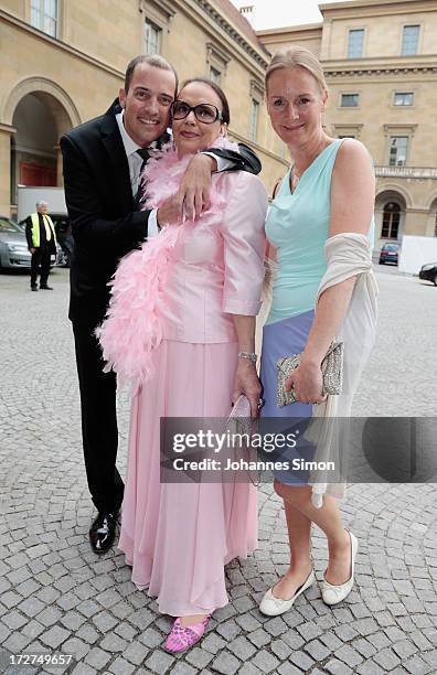 Patrick Wolff, his mother Marina Wolff and Carolin Fink arrive for the Bernhard Wicki Award ceremony at Munich Film Fesitval on July 4, 2013 in...