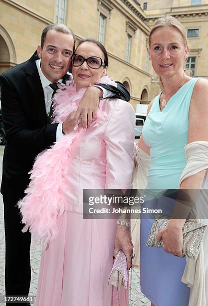 Patrick Wolff, his mother Marina Wolff and Carolin Fink arrive for the Bernhard Wicki Award ceremony at Munich Film Fesitval on July 4, 2013 in...