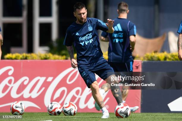Lionel Messi of Argentina plays the ball during a training session ahead of the Qualifiers match against Peru at Lionel Messi Training Camp on...