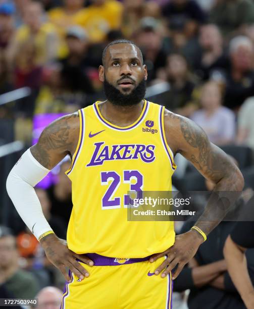 LeBron James of the Los Angeles Lakers waits for a Brooklyn Nets player to shoot a free throw in the first quarter of their preseason game at...