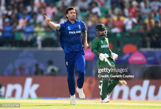 Reece Topley of England celebrates after dismissing Tanzid Hasan of Bangladesh during the ICC Men's Cricket World Cup India 2023 between England and...