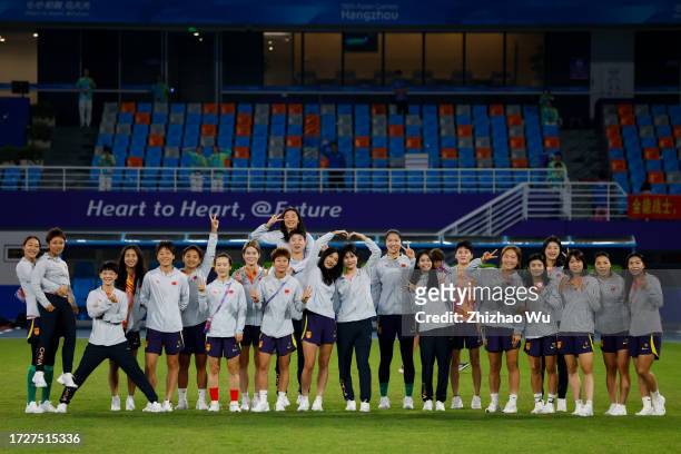 Players of China pose for group photo before the 19th Asian Games Women's Semifinal match between China and Japan at Linping Sports Centre Stadium on...
