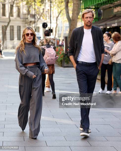 Abbey Clancy and Peter Crouch arrive at Heart Breakfast Radio Studios on October 10, 2023 in London, England.