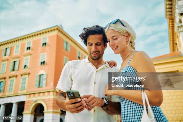 happy millennials discovering the charm of southern france, enjoying the coastal city of nice. - phone couple stock pictures, royalty-free photos & images