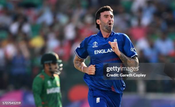 Reece Topley of England celebrates after dismissing Shakib Al Hasan of Bangladesh during the ICC Men's Cricket World Cup India 2023 between England...