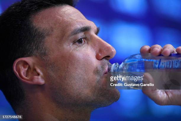 Lionel Scaloni coach of Argentina drinks water during a press conference after a training session ahead of the Qualifiers match against Peru at...