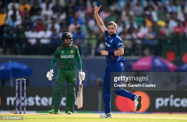 Chris Woakes of England celebrates after dismissing Mehidy Hasan Miraz of Bangladesh during the ICC Men's Cricket World Cup India 2023 between...