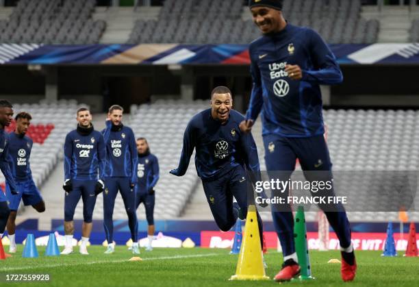 France's forward Kylian Mbappe attends a training session at Pierre-Mauroy stadium in Villeneuve-d'Ascq, near Lille, northern France on October 16 on...