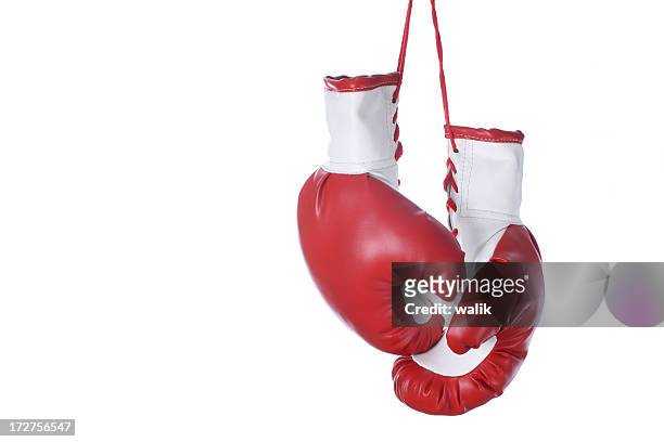 red and white boxing gloves isolated on a white background - red glove stockfoto's en -beelden