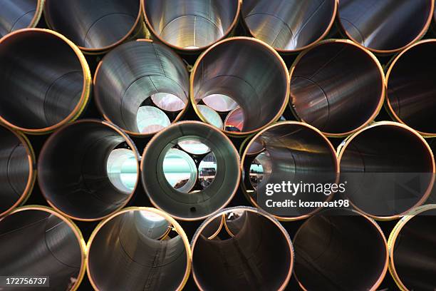 stacked steel pipe abstract - oil and gas industry stockfoto's en -beelden