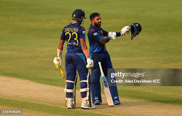 Kusal Mendis of Sri Lanka celebrates their century alongside teammate Sadeera Samarawickrama during the ICC Men's Cricket World Cup India 2023...