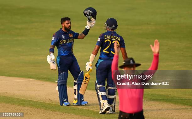 Kusal Mendis of Sri Lanka celebrates their century alongside teammate Sadeera Samarawickrama during the ICC Men's Cricket World Cup India 2023...