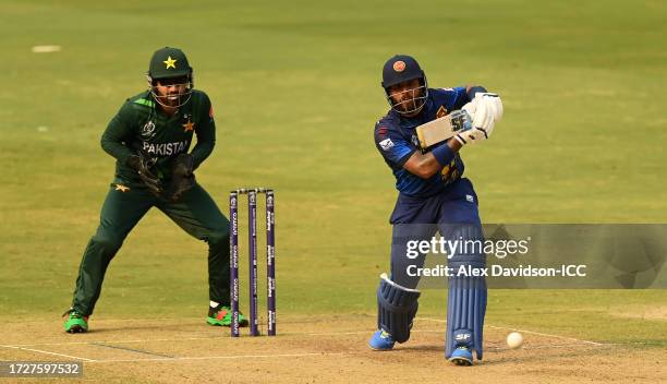 Kusal Mendis of Sri Lanka plays a shot as Mohammad Rizwan of Pakistan keeps during the ICC Men's Cricket World Cup India 2023 between Pakistan and...