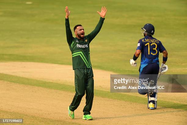 Mohammad Nawaz of Pakistan appeals unsuccessfully as Kusal Mendis runs between the wickets during the ICC Men's Cricket World Cup India 2023 between...