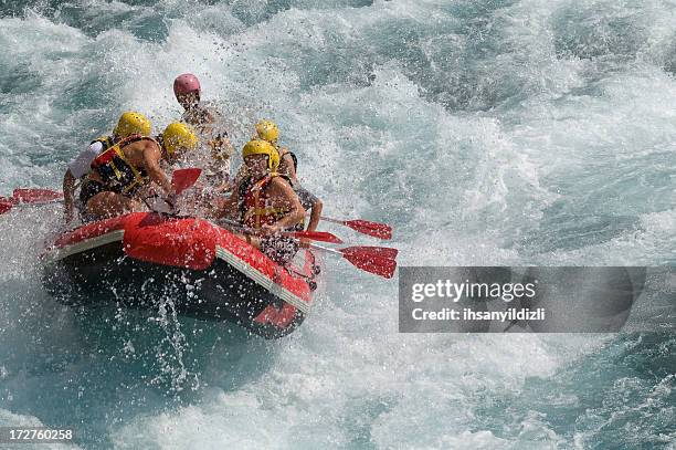 rafting on white water in a storm - boat river stockfoto's en -beelden