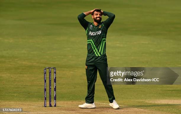 Shadab Khan of Pakistan reacts after a missed runout opportunity during the ICC Men's Cricket World Cup India 2023 between Pakistan and Sri Lanka at...