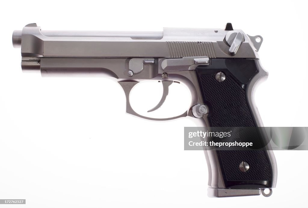 A silver semi auto handgun on white background