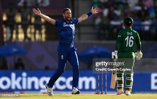 Chris Woakes of England celebrates after dismissing Litton Das of Bangladesh during the ICC Men's Cricket World Cup India 2023 between England and...