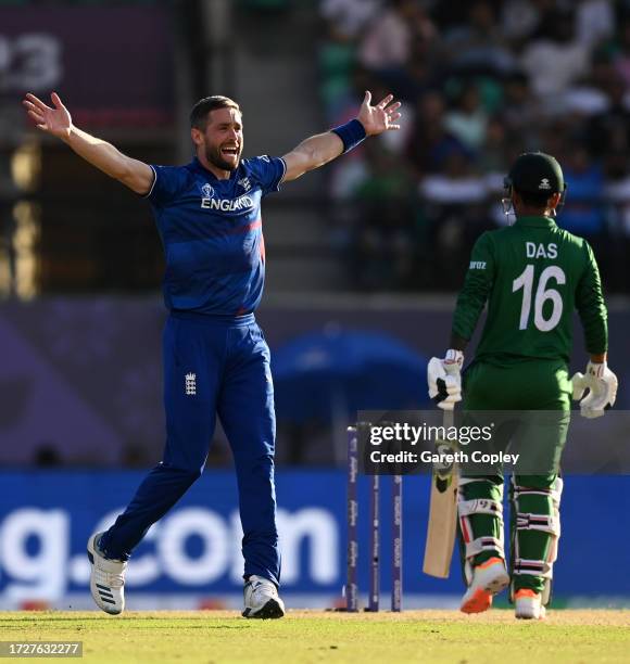 Chris Woakes of England celebrates after dismissing Litton Das of Bangladesh during the ICC Men's Cricket World Cup India 2023 between England and...