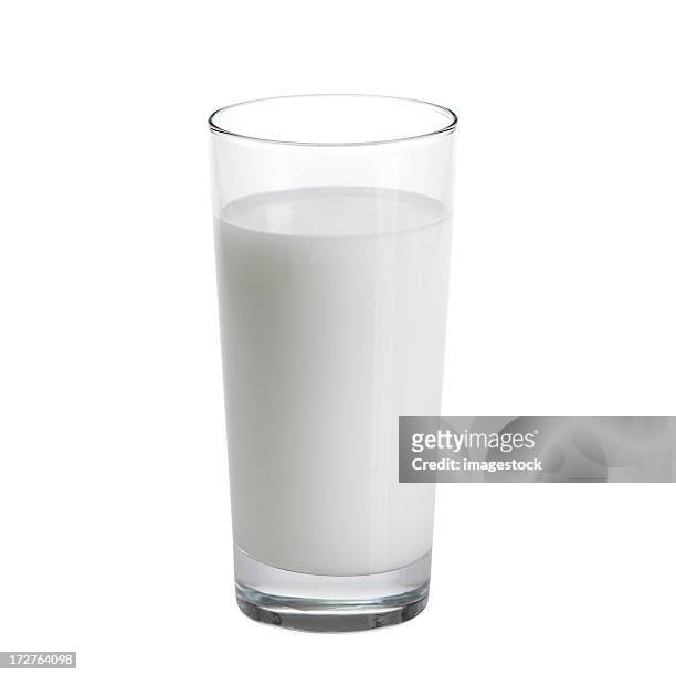 tall glass of milk against a white background - drinking glass stock pictures, royalty-free photos & images
