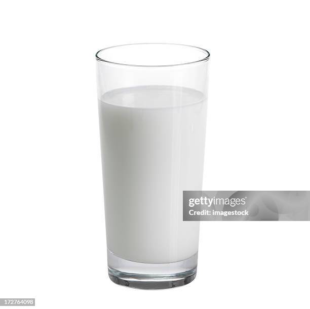 tall glass of milk against a white background - glass of milk stock pictures, royalty-free photos & images