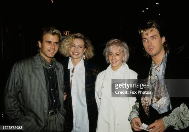 British pop stars Steve Norman and Martin Kemp of Spandau Ballet with their girlfriends, including Shirlie Holliman of Wham! , 1984.