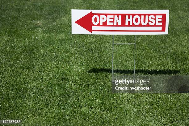real estate open house sign, red and white sign in grass. - yard sign stock pictures, royalty-free photos & images