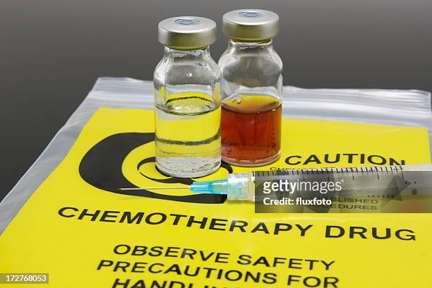 a syringe and two vials of chemotherapy drugs - chemotherapy drug stock pictures, royalty-free photos & images
