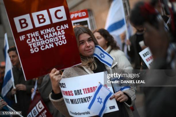 Protesters holding placards and Israeli flags join a gathering outside the headquarters of the BBC in London on October 16 to appeal to the...