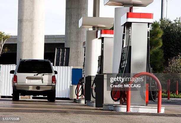 a car at the gas stations no pumps in use - fuel prices stock pictures, royalty-free photos & images