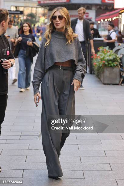 Abbey Clancy leaving Global Radio Studios on October 10, 2023 in London, England.