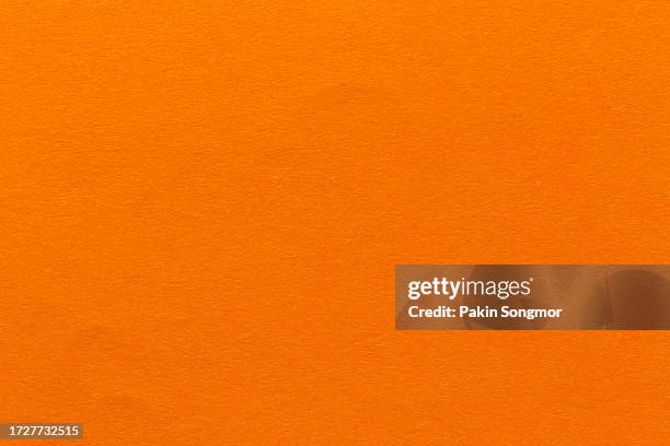 orange color paper sheet texture cardboard background. - oranje achtergrond stockfoto's en -beelden