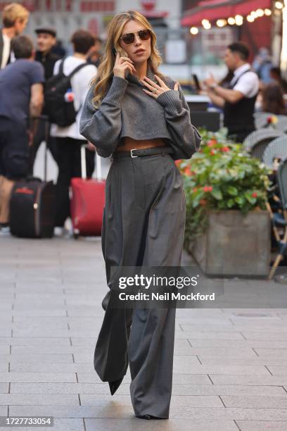 Abbey Clancy leaving Global Radio Studios on October 10, 2023 in London, England.