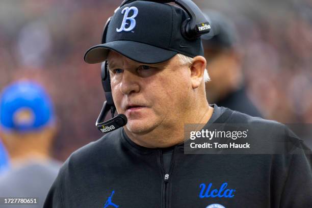 Head coach Chip Kelly of the UCLA Bruins walks on the field against the Oregon State Beavers during the first half at Reser Stadium on October 14,...