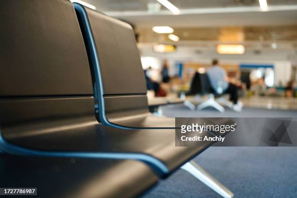 close-up of chairs at the airport - airport terminal stock pictures, royalty-free photos & images