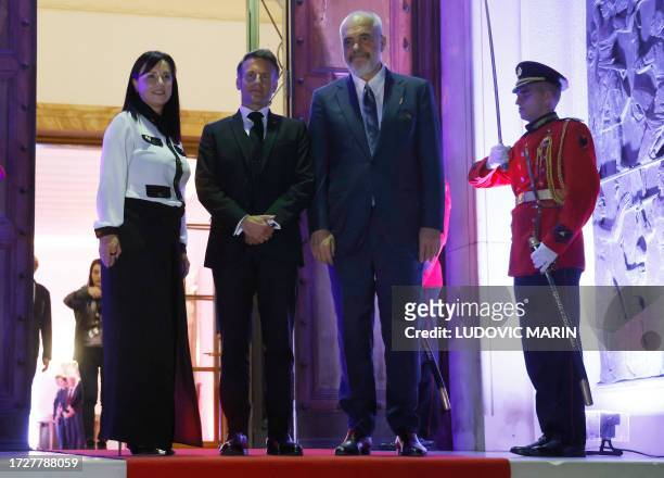 Albanian Prime Minister Edi Rama and his wife Linda Rama welcome France's President Emmanuel Macron before a meeting at the Palace of Brigades in...