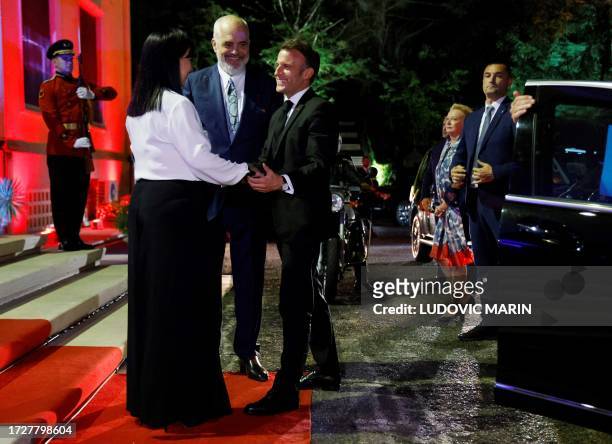 Albanian Prime Minister Edi Rama and his wife Linda Rama welcome France's President Emmanuel Macron before a meeting at the Palace of Brigades in...