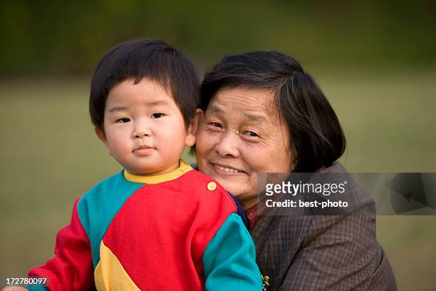 grandmother and grandson - bestphoto stock pictures, royalty-free photos & images