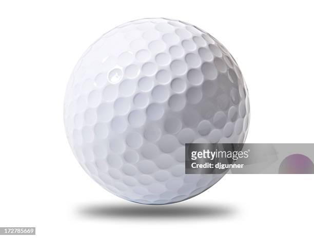 a white golf ball hovering above ground - golfboll bildbanksfoton och bilder