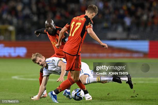 Sweden's defender Filip Helander fights for the ball with Belgium's forward Romelu Lukaku and Belgium's midfielder Charles De Ketelaere during the...