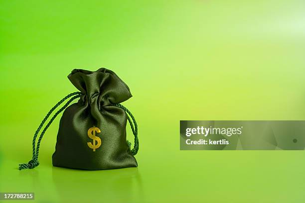 sack and dollars - green purse stock pictures, royalty-free photos & images