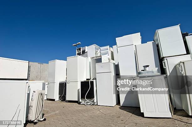 old refrigerators waiting to be  scrapped at a recycling center - white goods stock pictures, royalty-free photos & images