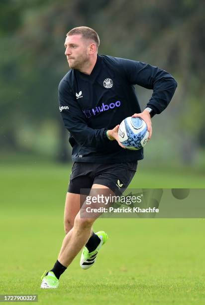 Finn Russell of Bath Rugby with the ball during a Bath Rugby training session at Farleigh House on October 10, 2023 in Bath, England.