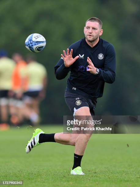 Finn Russell of Bath Rugby receives the ball during a Bath Rugby training session at Farleigh House on October 10, 2023 in Bath, England.