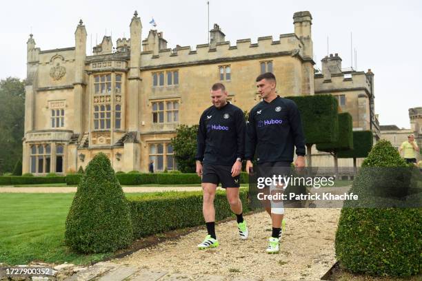 Finn Russell and Cameron Redpath of Bath Rugby walk onto the pitch prior to a Bath Rugby training session at Farleigh House on October 10, 2023 in...