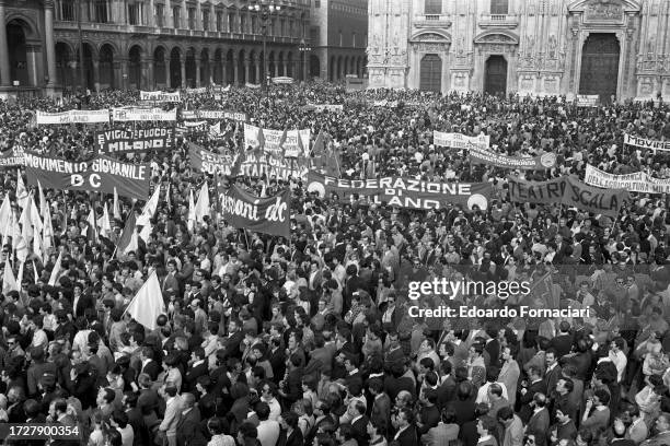 Elevated view of demonstrators, many with banners, in Piazza del Duomo as they protest the murder of politician Aldo Moro, Milan, Italy, May 9, 1978....