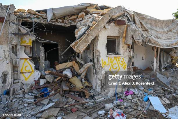 View of a house left in ruins after an attack by Hamas militants on this kibbutz days earlier when dozens of civilians were killed near the border...