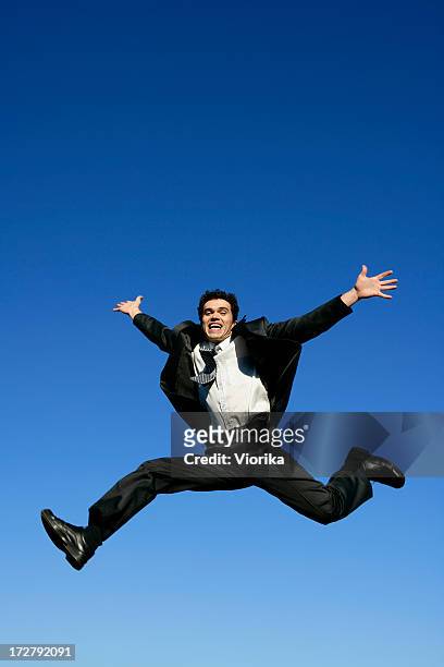 jumping businessman - leap forward stock pictures, royalty-free photos & images