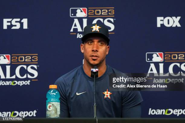 Michael Brantley of the Houston Astros talks during a press conference before Game 2 of the ALCS between the Texas Rangers and the Houston Astros at...